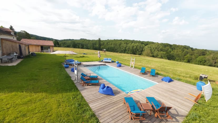 Heated pool with sun loungers and panoramic view La Demeure en Périgord Dordogne